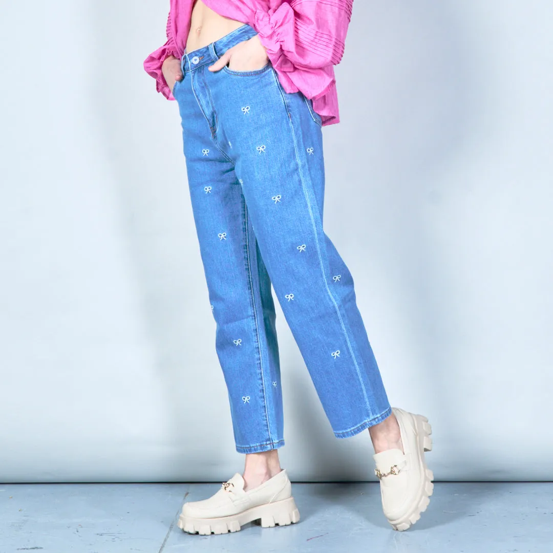 Embroidered denim jeans with bow details wholesale