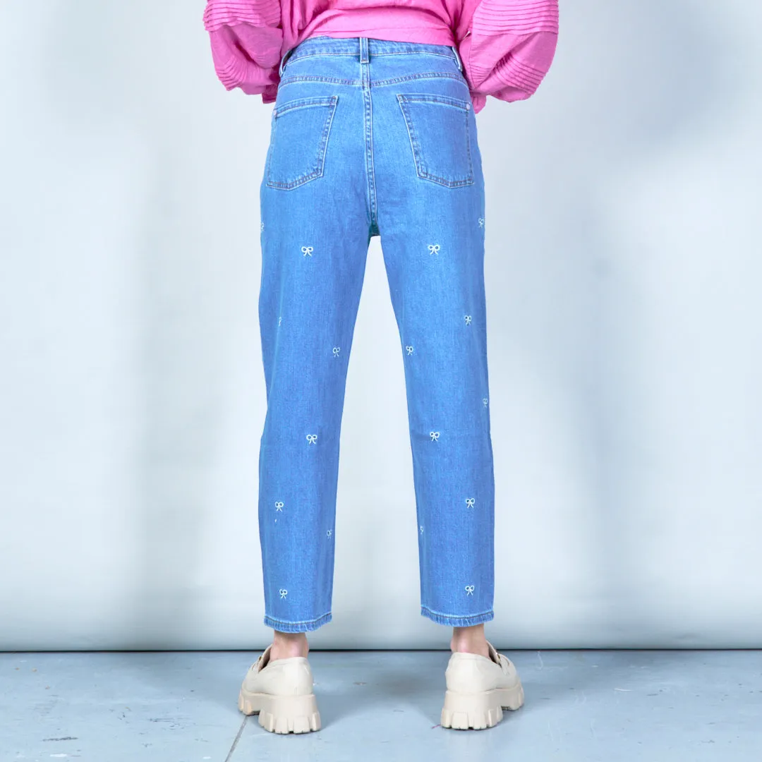 Embroidered denim jeans with bow details wholesale