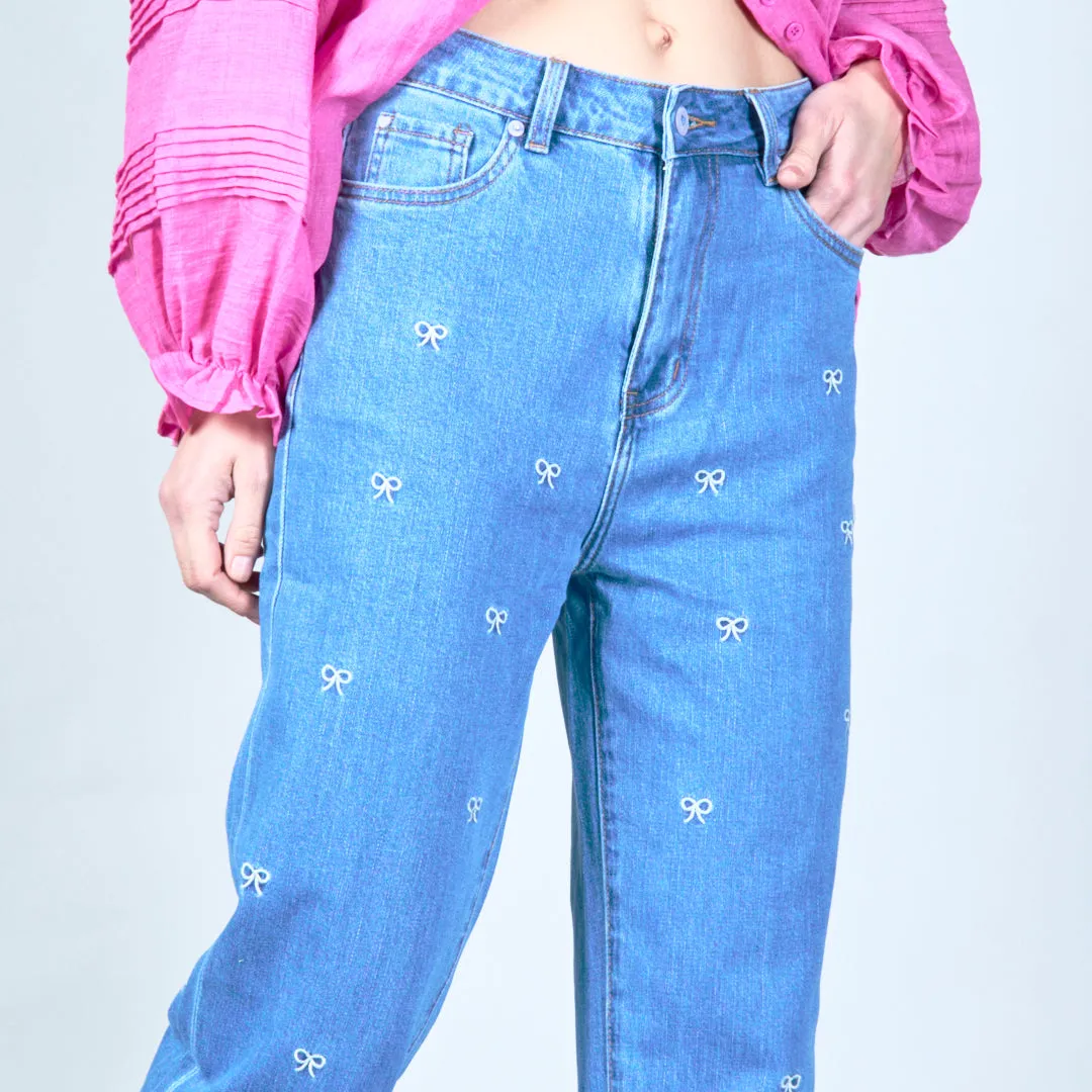 Embroidered denim jeans with bow details wholesale