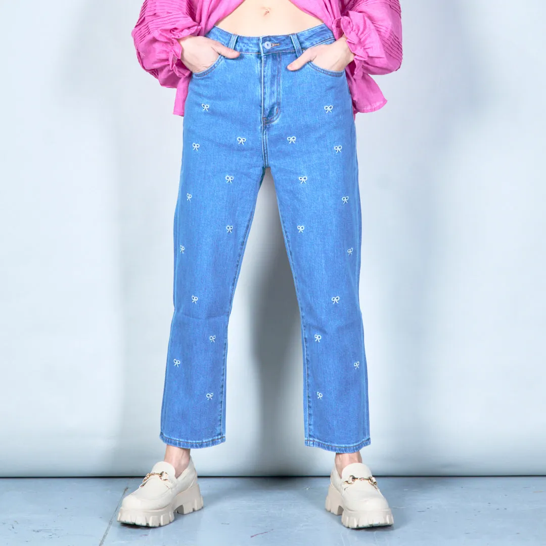 Embroidered denim jeans with bow details wholesale