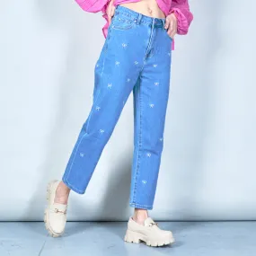 Embroidered denim jeans with bow details wholesale