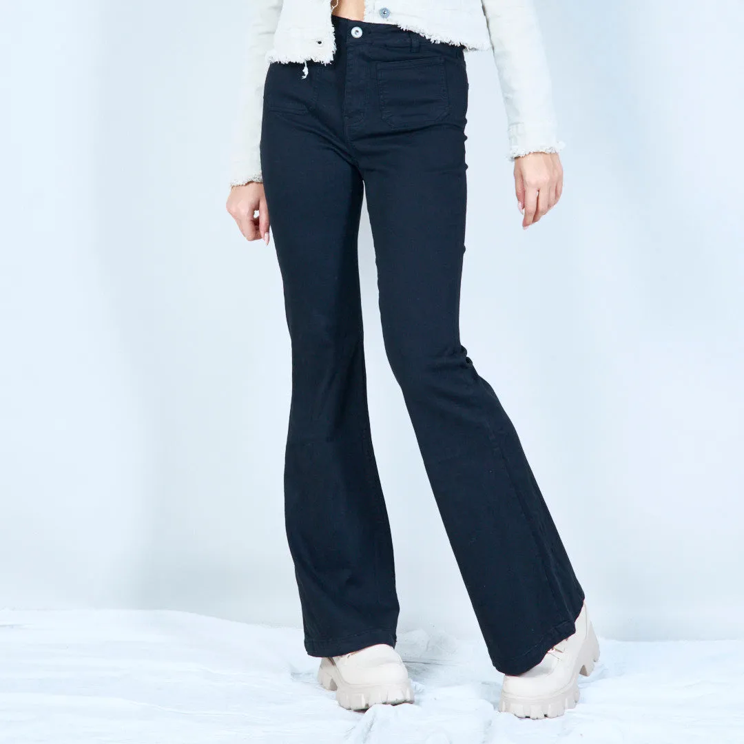 Flared white denim jeans with front pockets wholesale